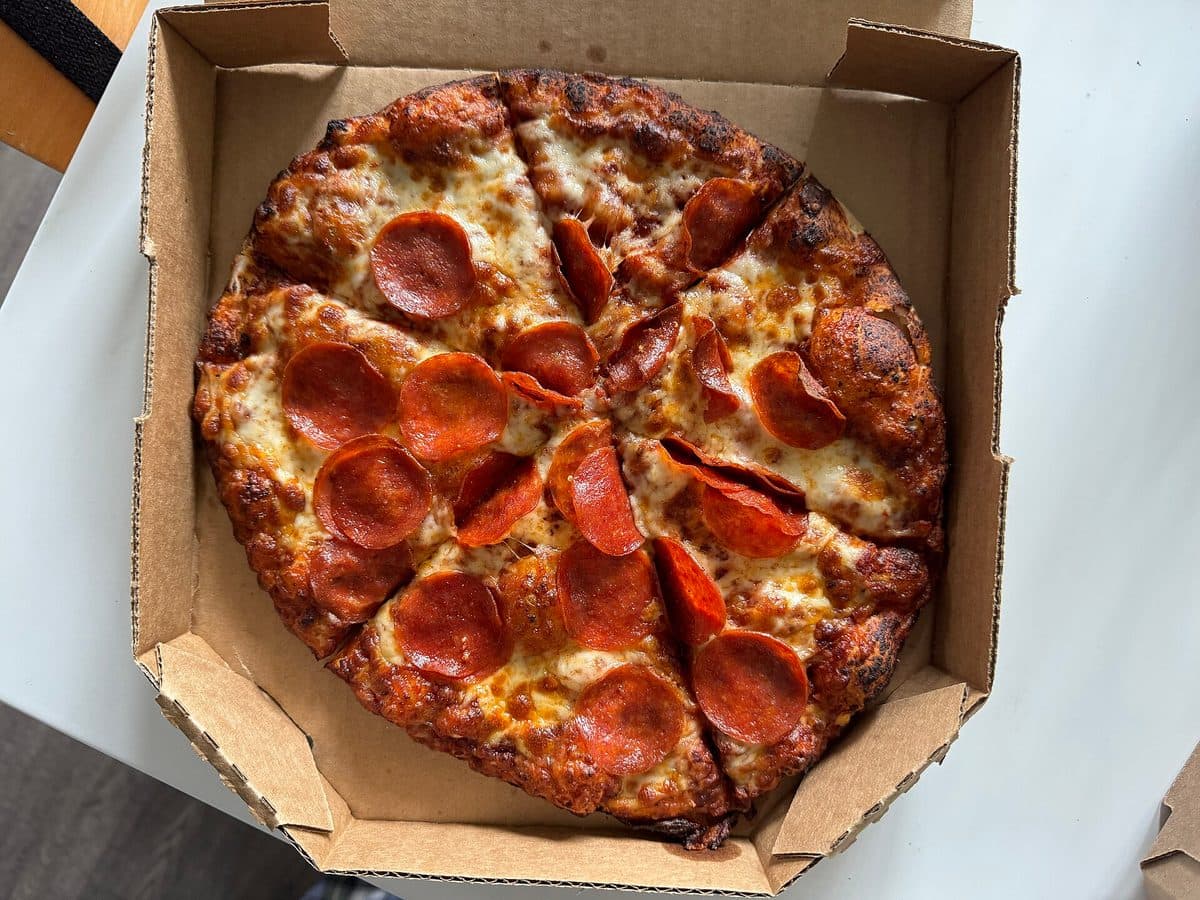 Family Feast — 2 large pizzas + 2 sides + 4 drinks