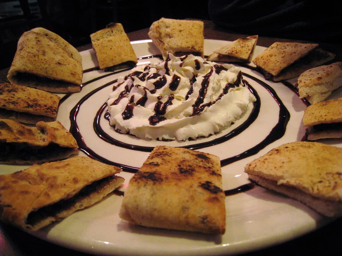 Nutella Calzone — Folded dough, Nutella, powdered sugar